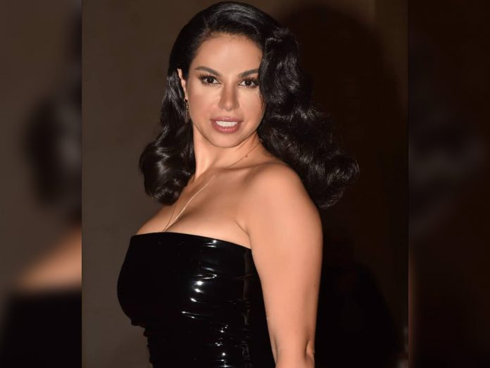 Nesreen Amin wearing black latex fashion dress at Murex D’or 2019 Awards