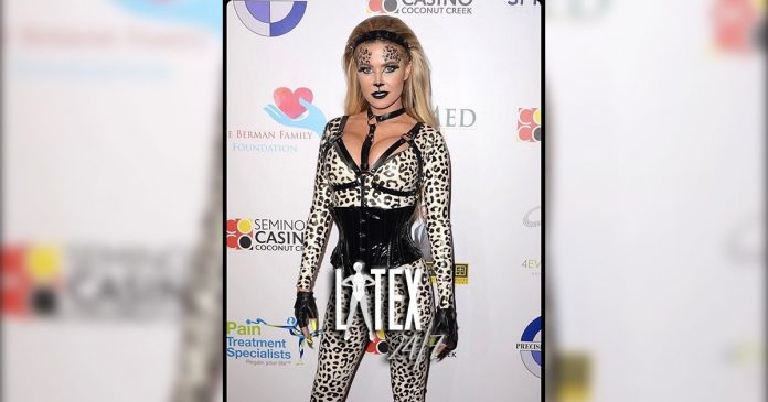 Carmen Electra wears Vex Clothing Latex Catsuit to Halloween Party 2019