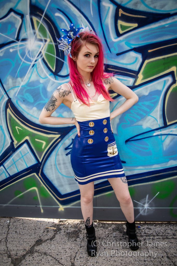 Latex Fashion Model Luci Fallen wears Seven Sin Latex