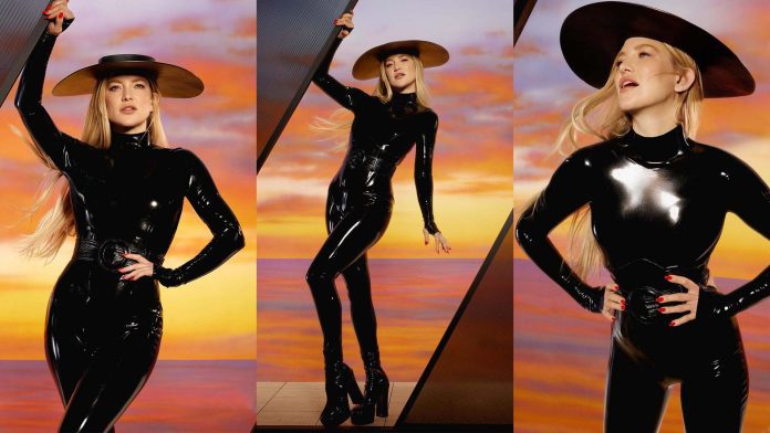 Actress Kate Hudson is photographed wearing a stunning black Vex latex catsuit for Netflix Queue magazine interview