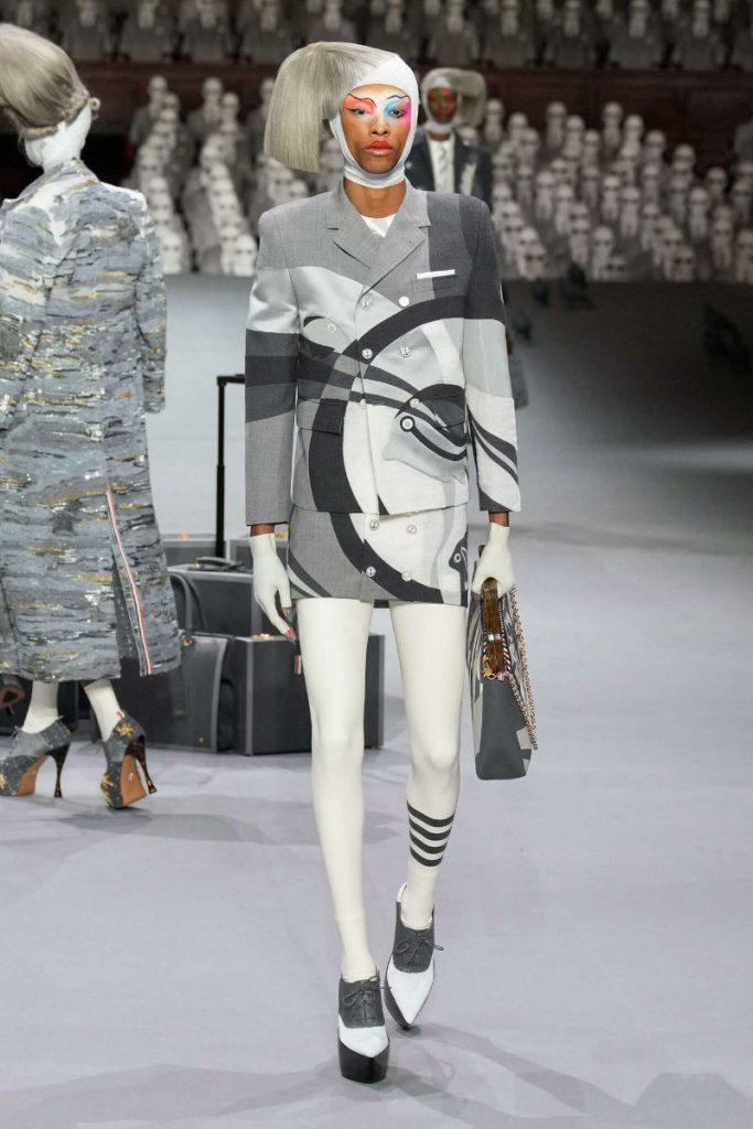 Model wears Vex Latex stockings and gloves during Thom Browne Couture collection reveal