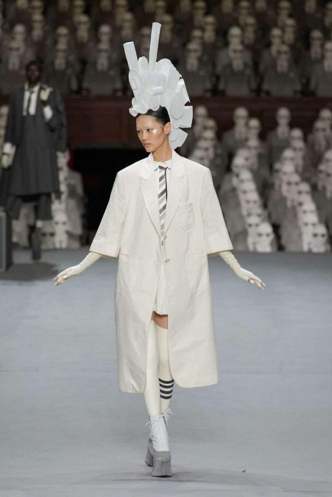 Model wears Vex Latex stockings and gloves during Thom Browne Couture collection reveal
