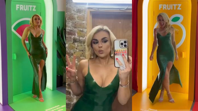 Tallia Storm wears Latex Couture latex dress gown for Fruitz app
