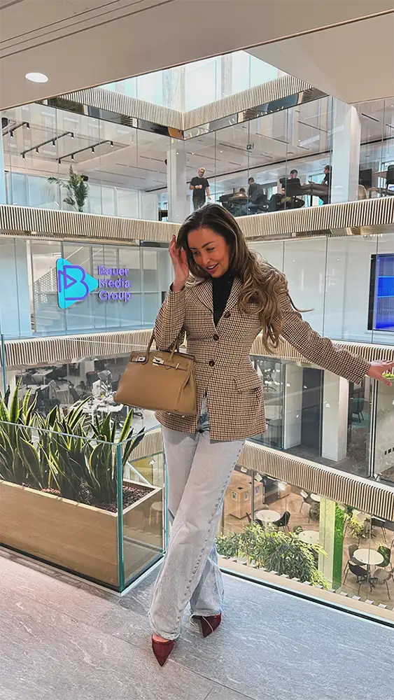 Ella Morgan wears Scarlett Society Label latex bodysuit, ASOS blazer and faded jeans for Kiss UK radio appearance